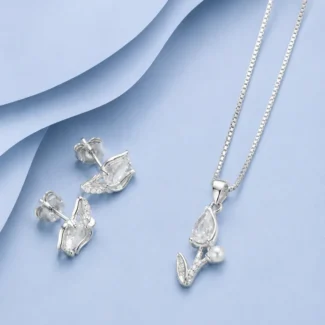 92.5 sterling silver pendant necklace with matching stud earrings featuring marquise-cut zircon stones and pearl accents displayed on a pastel blue luxury background.